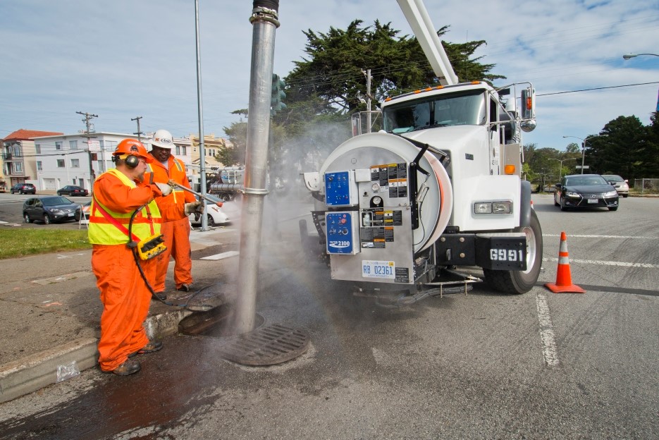 SFPUC crews cleaning a storm drain.